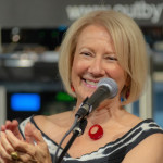 SUsan Seliger tells funny stories as Host and Founder of Out by 10