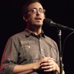Cropped, Aaron Wolfe at mic at Out by 10.